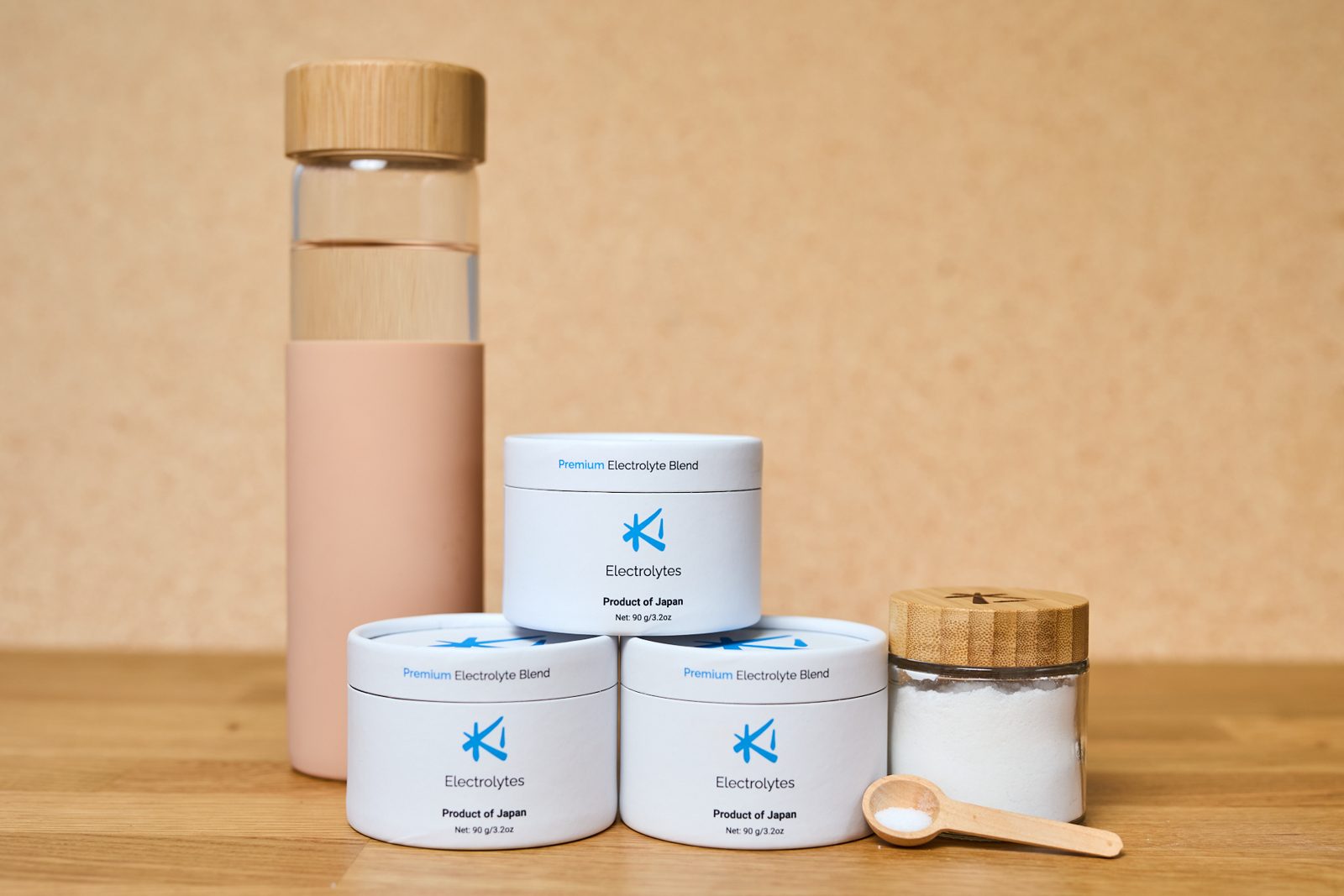 The Ki Three-Month Bundle: three Ki Electrolytes cylinders, a glass bottle, a glass jar and a wooden spoon